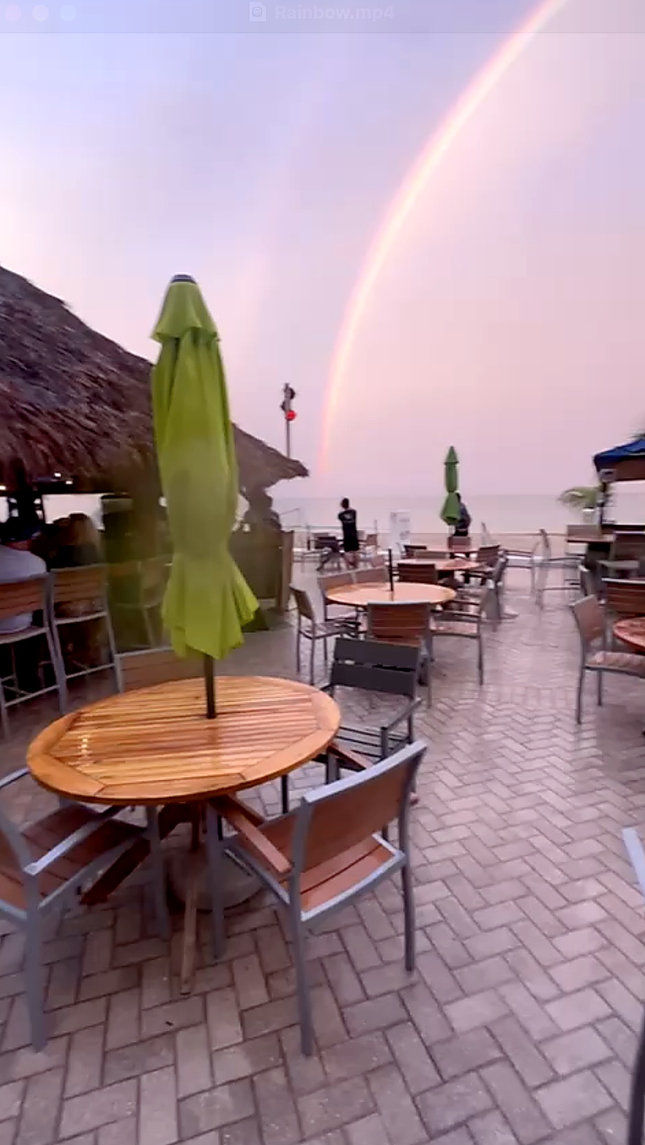 Rainbow above the shoreline near the Miracle Cross