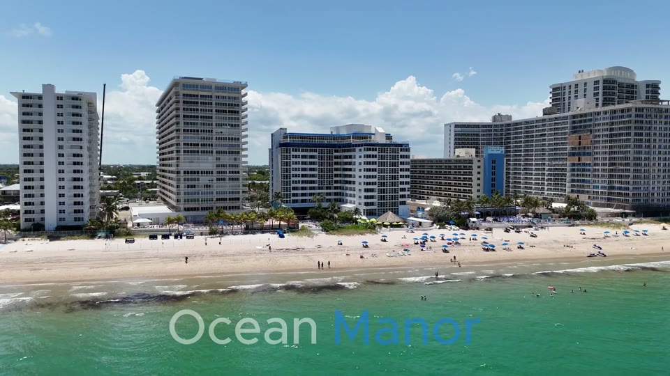 Crystal clear 4K aerial view of Ocean Manor's private beach and coastline