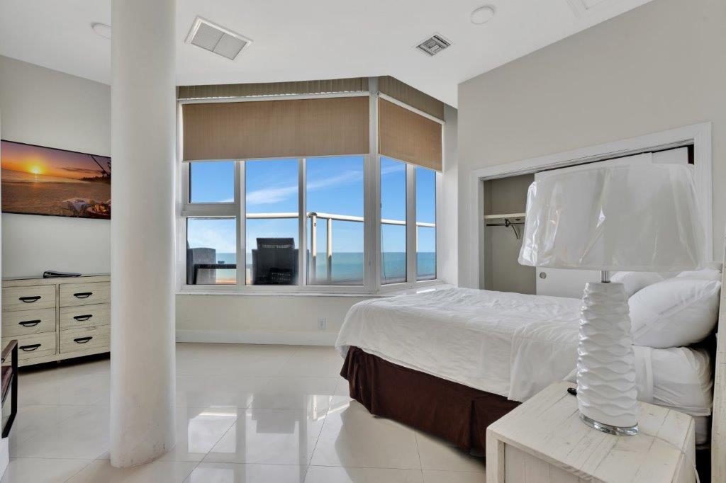 Spacious living room with oceanfront terrace in Penthouse 1101 at Ocean Manor Beach Resort