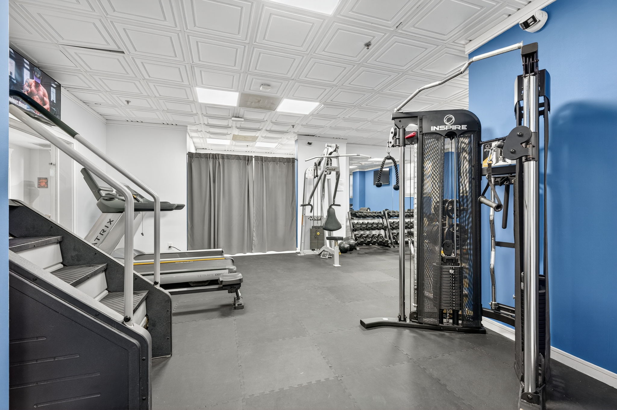 Mixed cardio and strength training area at Ocean Manor hotel gym